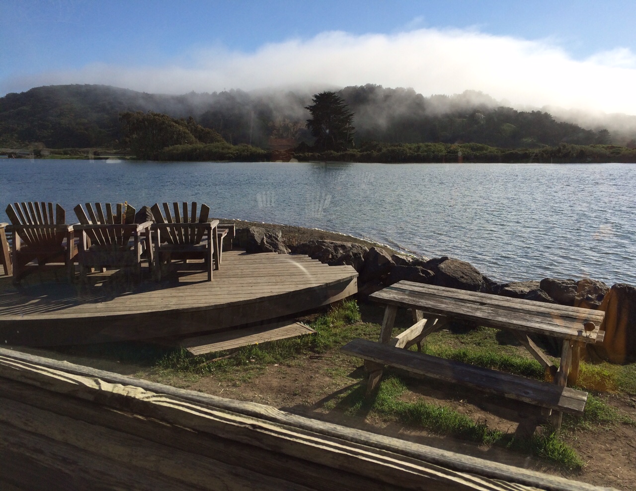 Radiant Reflection Demo/Transmission picture of three chairs next to the river in Jenner, California at Cafe Aquatica